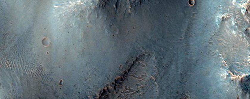 Bedrock Exposed in 60-Kilometer Crater East of Valles Marineris