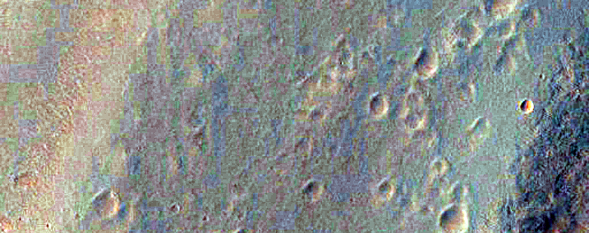 Streamlined Form Surrounded by Pitted Materials in Hale Crater