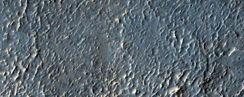 Possible Phyllosilicates in Edge of Crater Ejecta Near Mare Serpentis