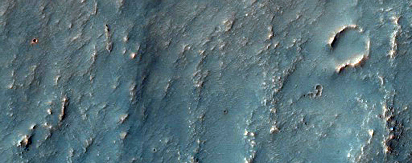 Possible Phyllosilicates Outside Pitted Crater Northwest of Hellas Planitia