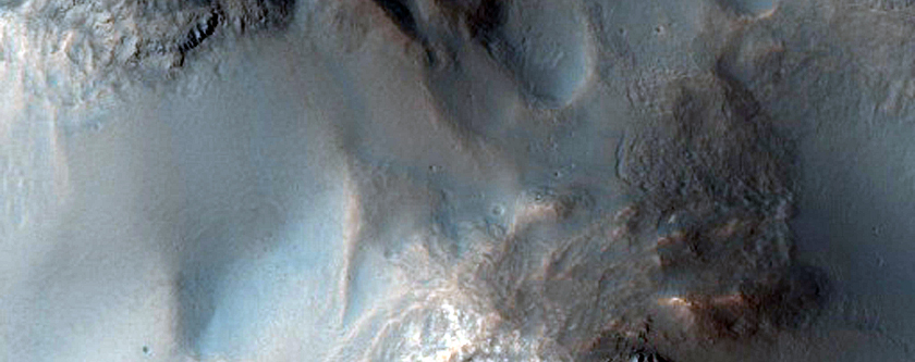 Well-Preserved Impact Crater with Central Peak and Gullied Walls