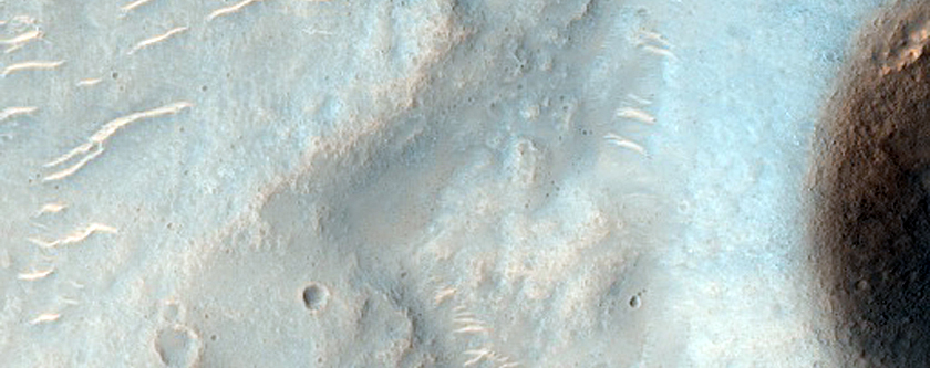 Possible Olivine-Rich Wind Streak Emanating from Crater with Possible Clays