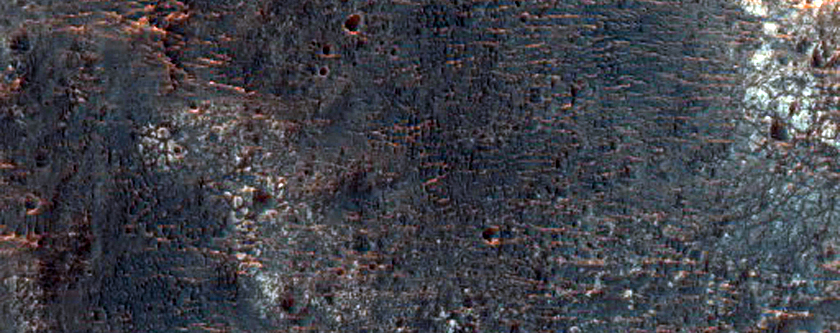 Light-Toned Material on Crater Floor Near Ladon Valles Basin