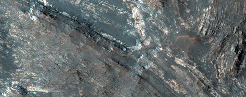 Layered Rocks Uplifted in Crater Near Solis Dorsa