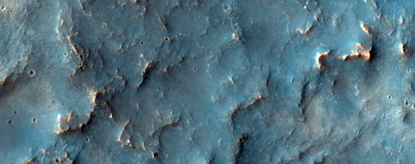 Possible Phyllosilicates in Eroded Terrain Near Channel