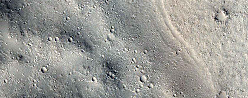 Gaten en kegels met ingedeukte top in Elysium Planitia