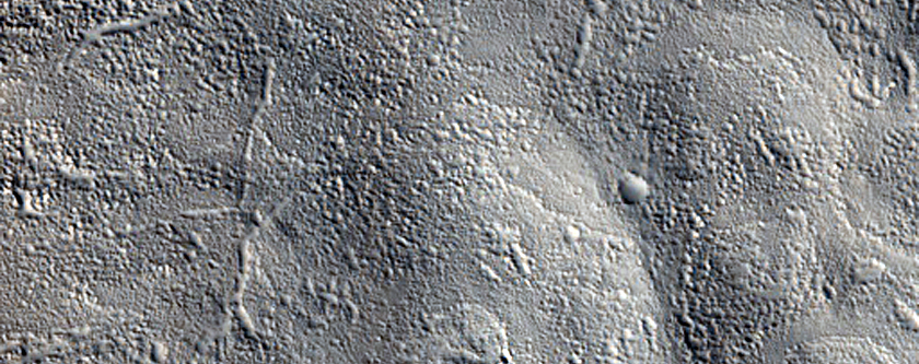 Flow Moving Around Crater Northwest of Erebus Montes