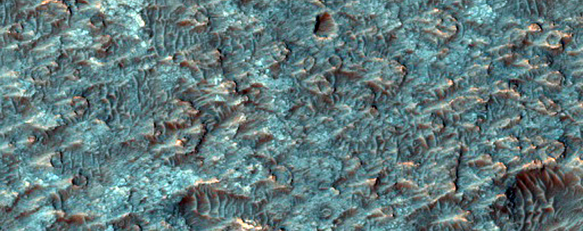 Crater Floor Deposit with Olivine and Pyroxene Signatures