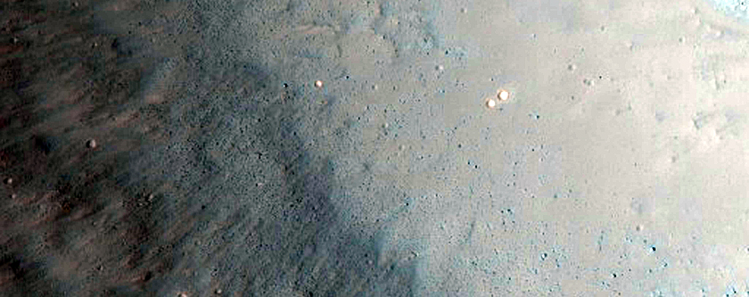 Possible Olivine-Rich Crater Ejecta in Solis Planum