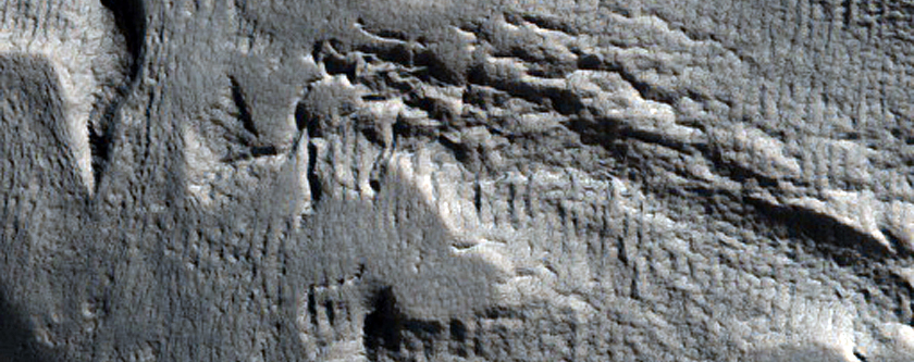 Crater with Steep Slopes Near Mamers Valles