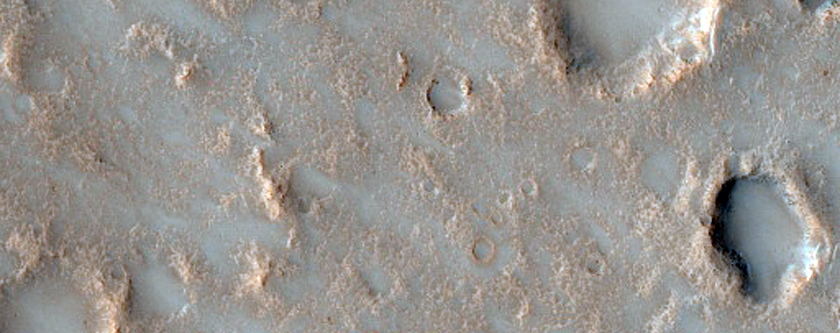 Possible Pitted Impact Melt Pond on the Ejecta of Bakhuysen Crater