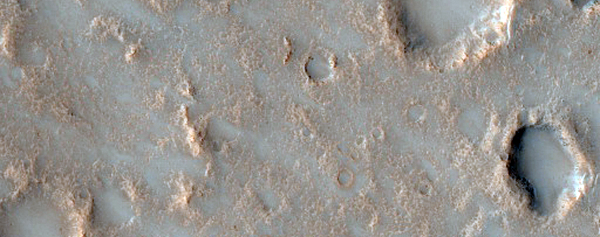 Possible Pitted Impact Melt Pond on the Ejecta of Bakhuysen Crater