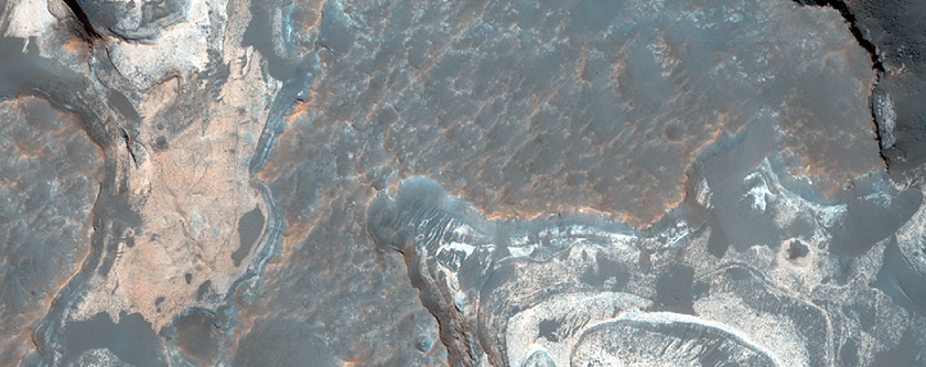 Layered Materials on Northeast Hellas Planitia Rim