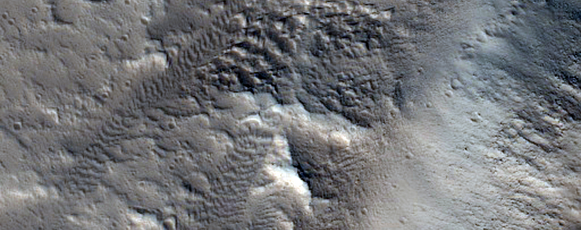 Uitwaaierende kanalen in Tantalus Fossae