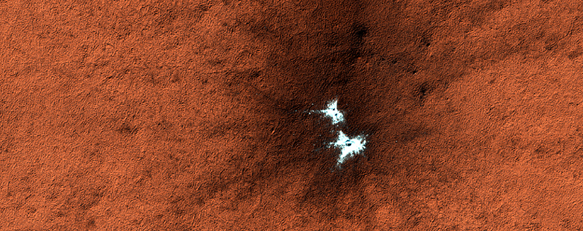 Candidate New Impact Site with Possible Ice