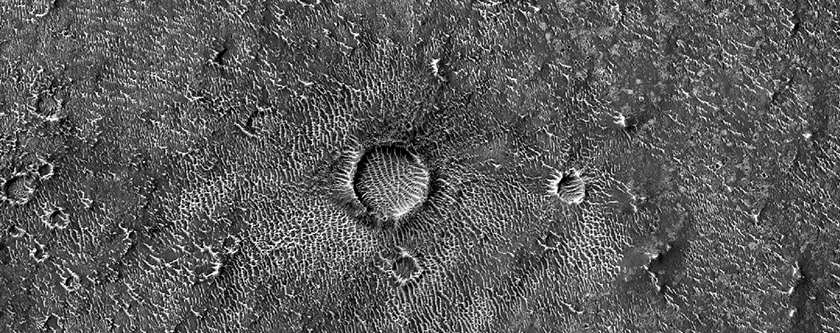 Possible Phyllosilicate-Rich Terrain on Eroded Crater Floor