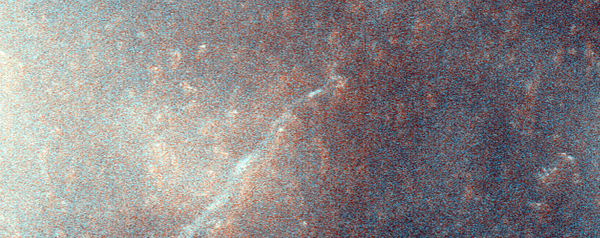 Possible Fan at Terminus of Channel on Lyot Crater Ejecta