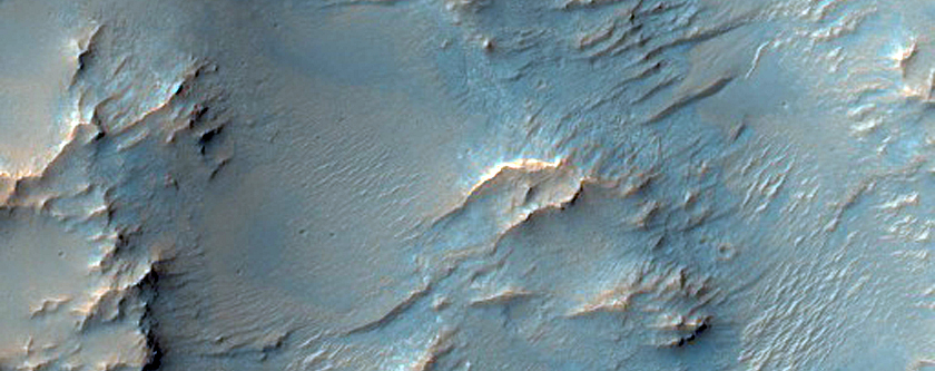 Possible Low-Calcium Pyroxene Outcrops South of Huygens Crater