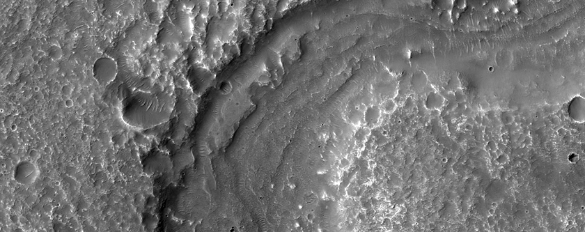 Streamlined Features in Channel in Coronae Montes Region