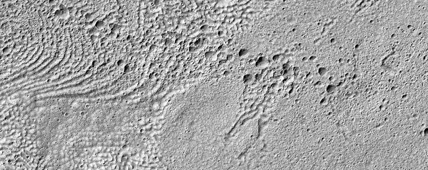 Linear Cluster of Pits in Mid-Latitude Crater Floor Material