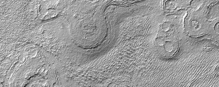 Weird Circular Landforms on Hellas Region Floor