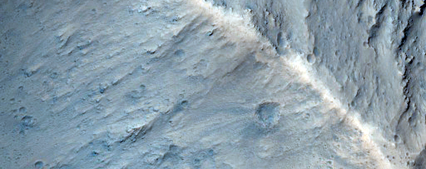 Impact Crater Exposed by Erosion along Candor Chasma