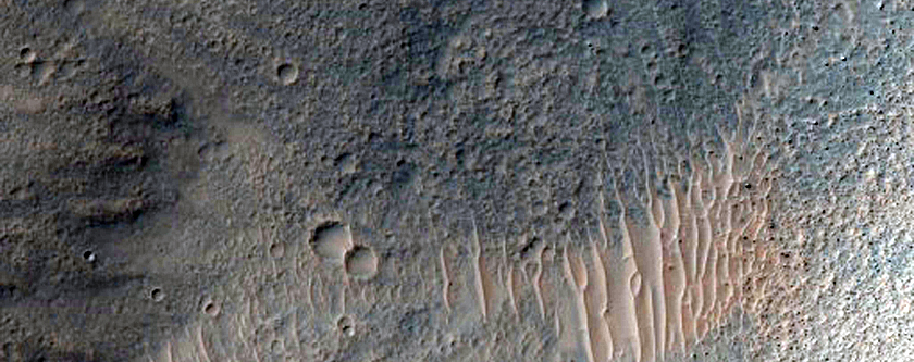 Impact Crater Exposing Bedrock