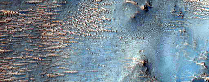 Two Impact Craters Exposing Bedrock