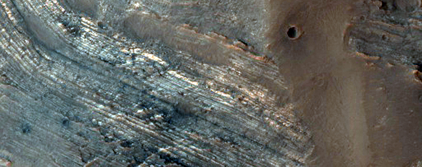 Tilted Layers in Center of Oudemans Crater