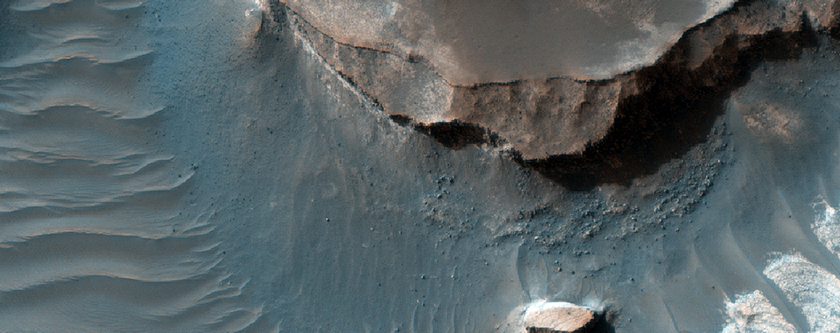 Layered Materials on Northeast Hellas Planitia Rim