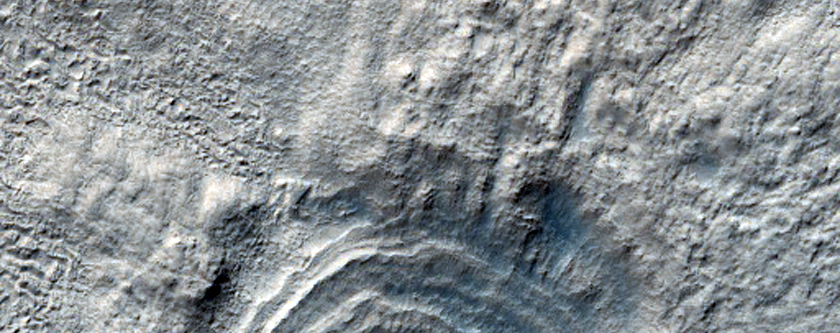 Crater with Pedestalized Ejecta and Concentric Circles on Floor