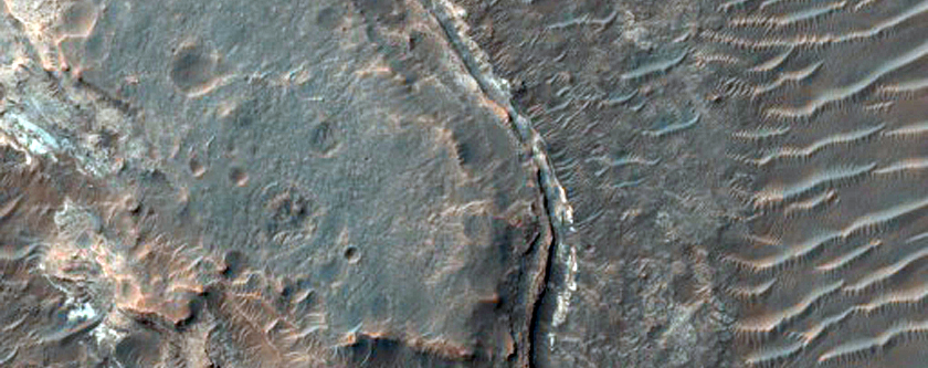 Exposures of Light-Toned Layered Material along Ladon Valles Floor