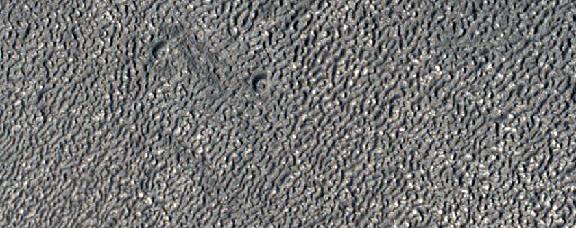 Channel with Evidence of Lineated Valley Fill and Terraced Craters