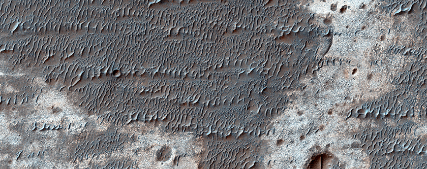 Light-Toned High Thermal Infrared Deposit on Eroded Crater Floor
