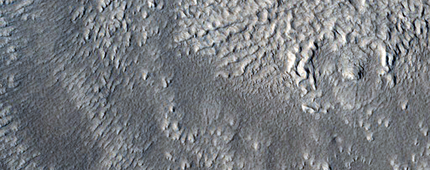 Craters and Mantling Material in Phlegra Montes