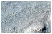 Tongue-Shaped Flow Features East of Hellas Region
