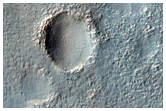 Valley Breaching Through Rim of Arkhangelsky Crater
