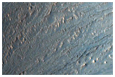 Putative Clays in Capri Chasma Wall and Chaotic Floor
