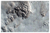 Well-Preserved 15-Kilometer Diameter Crater Near Alba Mons
