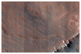 Crater on Floor of Coprates Chasma