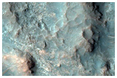 Layered Bedrock Exposure on Crater Floor