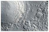 Small Channels in Cerulli Crater Ejecta