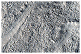 Small Channels on Floor of Northern Mid-Latitude Crater