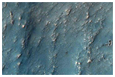 Possible Phyllosilicates Outside Pitted Crater Northwest of Hellas Planitia