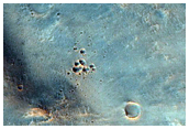 Excavated Possible Hydrated Minerals in the Floor of Ares Vallis