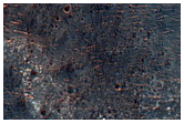 Light-Toned Material on Crater Floor Near Ladon Valles Basin