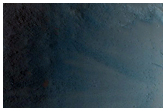 Possible Olivine and Mg-Fe Phyllosilicate-Rich Ejecta in Hesperia Planum