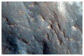 Fluvial Features and Phyllosilicates Near Hashir Crater