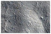 Flow Moving Around Crater Northwest of Erebus Montes
