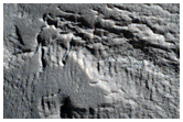 Crater with Steep Slopes Near Mamers Valles